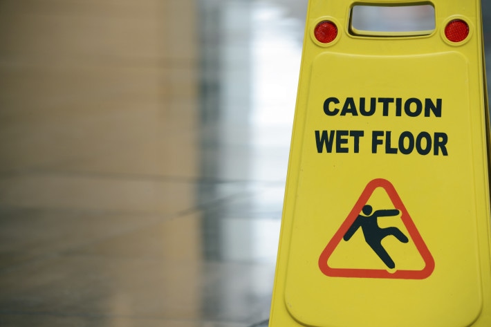 Caution wet floor sign in a new corporate building.